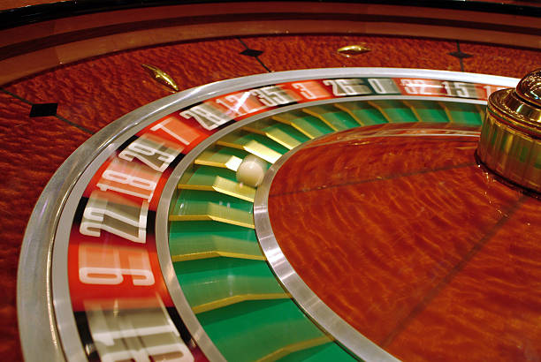 Live Qiu Qiu dealer at table with card dealing position